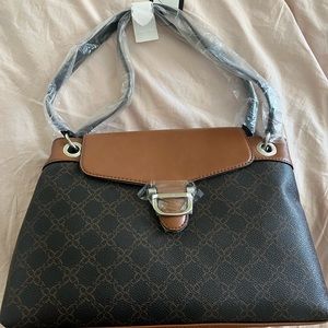 Brand new Black and Tan Nine West purse with shoulder strap.